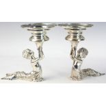 Pair of sterling silver mermaid themed compotes marked C.J. Vander, 8" H x 8 1/4" W. Provenance: