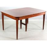 Early 20th century mahogany Hepplewhite dining table having substantial bellflower and panel