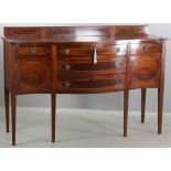 19th/20th century mahogany Hepplewhite sideboard having serpentine front, substantial bellflower and