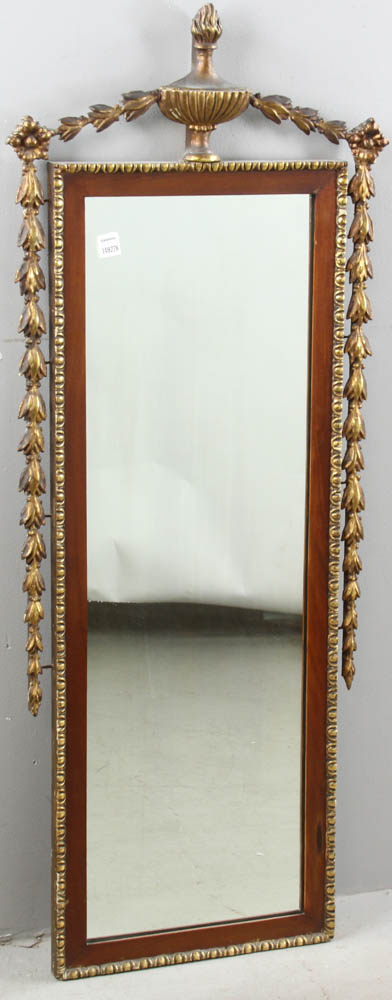 19th century looking glass with flame finial urn and drape crest, 46" H x 20" W. Replaced glass.