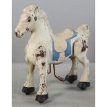 19th century Mobo Iron Riding Horse, articulated child's ride-on toy, 29 1/2" H x 27" L x 10" W.