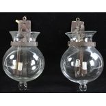 Pair of mid-20th century iron lamps with glass domes, 12" x 16". Provenance: Wakefield,