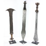 Group of three swords, two from Democratic Republic of Congo, one from Zaire. Late 19th century.