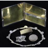 Group of assorted silver pieces to include: sterling cigarette case; belt buckle; designer pin by '