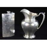 Sterling pitcher, 9" H together with sterling flask, 8 1/2", approximately 32.4 troy oz TW.