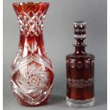 Ruby cut to clear decanter, 11 1/2" H, together with a ruby cut to clear vase, 14" H. Provenance: