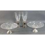 Pair of weighted sterling candlesticks with engraved glass chimneys, 12 " H together with pair of