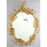 Late 19th/early 20th century French style oval mirror with trumpet blowers and hummingbird, 42" H