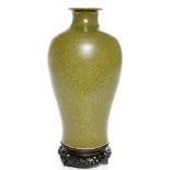 The vase with a spreading foot raising to a wide shoulder and waisted neck with flat mouth rim,