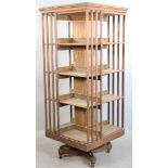 Antique oak revolving bookcase, 58 1/2" H x 24" square. Provenance: Estate of George Pollard