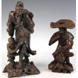 Two antique carved Japanese wooden figures, 14" H and 10" H. Provenance: West Palm Beach, Florida