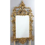 Chippendale-style giltwood mirror depicting flowers and vines on trellis with swan, 69"H x 34"W.