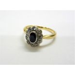 18ct. Gold Sapphire & Diamond Ring, central oval sapphire surrounded by diamonds, size L