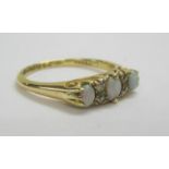 Ladies 18ct Gold Opal & Diamond 3 Stone Ring with graduated oval opals set 2 small diamond points