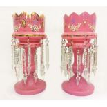 Pair Victorian Pink Glass Lustres on circular domed feet with baluster shaped stems, crenelated