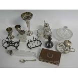 Box containing assorted mixed silver plated wares to include an egg cup stand, spill vase, toast