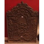 Heavy and large cast iron fire back, moulded with putti and figures, foliage and scrolls etc,