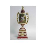Vienna style two-handled vase and stand with decorative painted scene of a lady and cherub with