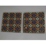 Pair of early 20th century Minton & Hollins tiles, painted in colours, 20cms wide