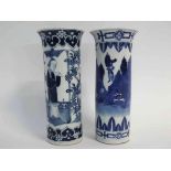 Matched pair of Chinese blue and white cylinder vases with fluted rim and figure printed design,