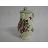 Cream ware jug with entwined handle, beadwork around rims and a cherub mask spout, matching lid,