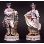 Pair of Continental figures of a gentleman and lady, flower sellers, both on round bases,