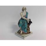19th century pottery figure in a pearl-ware glaze of a classical bearded gent seated on a stump with