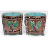 Pair of English Majolica jardinihres, each of cylindrical form and encrusted with ivy also decorated