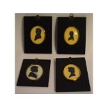 Group of four 20th century silhouettes, male and female profiles, assorted sizes (4)