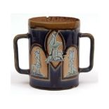 Royal Doulton stoneware two-handled loving cup, moulded with panels of shooting scenes, figures with