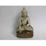 Eastern hardstone figure of a deity in the Lotus position, showing signs of partial gilding (a/f),