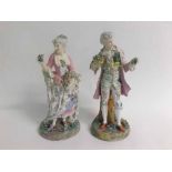 Pair of large Continental classical figures of a lady with a bouquet of flowers with a further