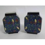 Pair of Royal Doulton square formed squat vases with a blue ground and floral and parakeet design,