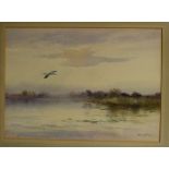 Roland Green, signed watercolour, Heron in flight over an estuary, 14 x 19ins