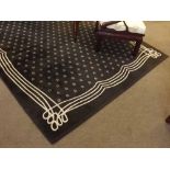 Modern brown carven carpet with a repeating star motif centre, 199cms wide x 300cms long