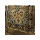 Modern wool carpet with cream and green field, central geometric lozenge with floral border,