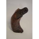 Composition Oriental figure in the form of a carved horn, 24cms high