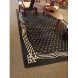 Modern brown carven carpet with a repeating star motif centre, 199cms wide x 300cms long