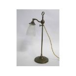 Early 20th century brass adjustable table lamp with fluted circular base, plain stem, looped