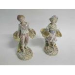 Pair of English porcelain figurines of male and female basket carriers, each stamped with