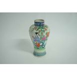 Oriental baluster vase, painted predominantly in famille rose (cover missing), 25cms high