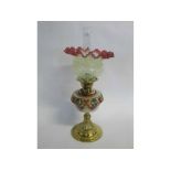 Victorian brass faced oil lamp with multi-coloured glass font and Vaseline and cranberry edged