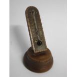 Early 20th century mahogany desk thermometer, with inlaid hatched border, 12cms high