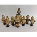 Set of eight early/mid-20th century painted plaster figures - Snow White and the seven Dwarfs,