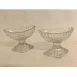 Pair of early 19th century faceted oval pedestal glass salts on diamond shaped bases, 3ins high