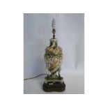 Mid to late 20th century Italian ceramic table lamp, embossed with figures and flowers and having