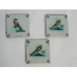 Set of three 18th/19th century glazed tiles, each decorated with a colourful bird, each 13cms x