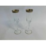 Pair of 20th century faceted and gilded champagne flutes, 24cms high