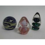 Group of three 20th century glass paperweights, including one by Mdina, (3)