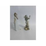 Nao figure of a young girl together with a further Spanish figure, 29 and 26cms high (2)
